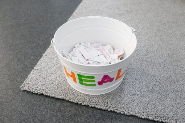 A white pail labeled 