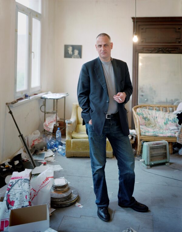 A man poses in an art studio