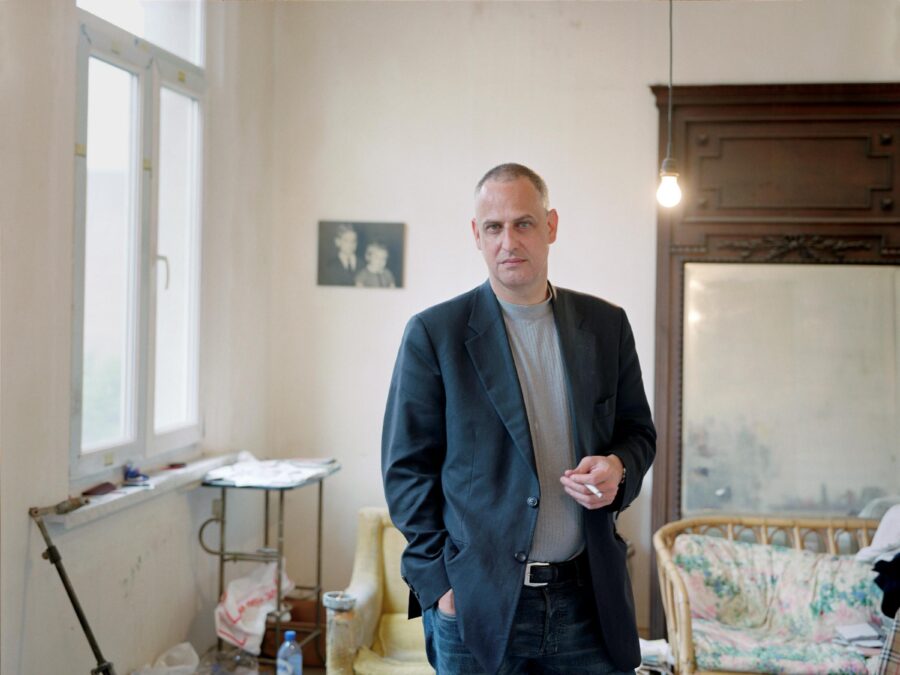 A man poses in an art studio