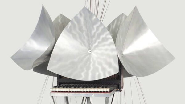 A small child's keyboard covered in several shiny metal conical objects, similar to satellite dishes