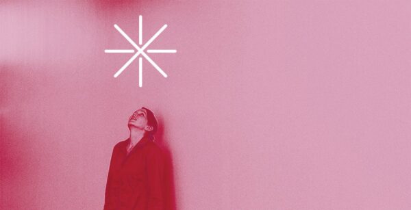 A fuschia tinged image of a person looking up at a large asterisk