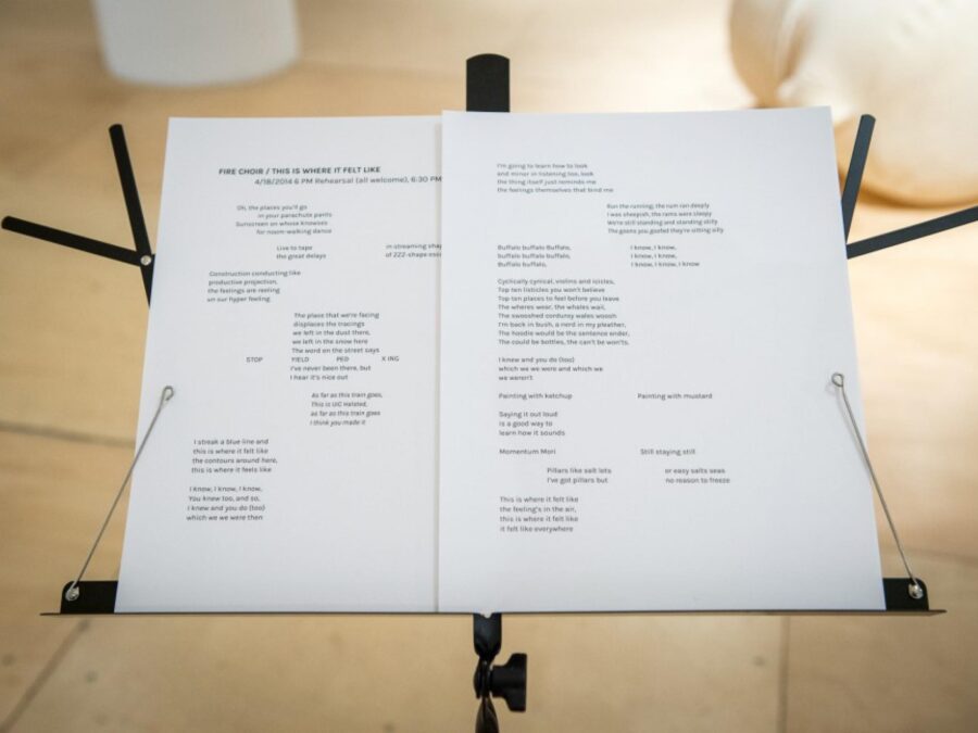 Music stand with two white pages on it filled with text in various columns