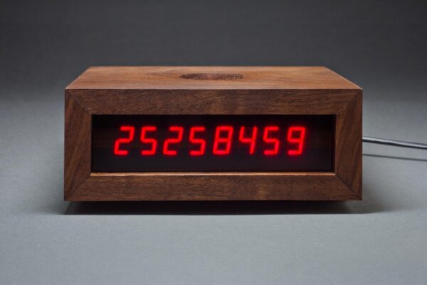 A digital clock with the number 25,258,459 on it