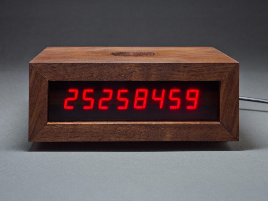 A digital clock with the number 25,258,459 on it