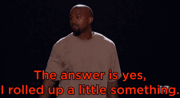 Gif of Kanye at the VMAs with a red caption reading The answer is yes. I rolled up a little something.