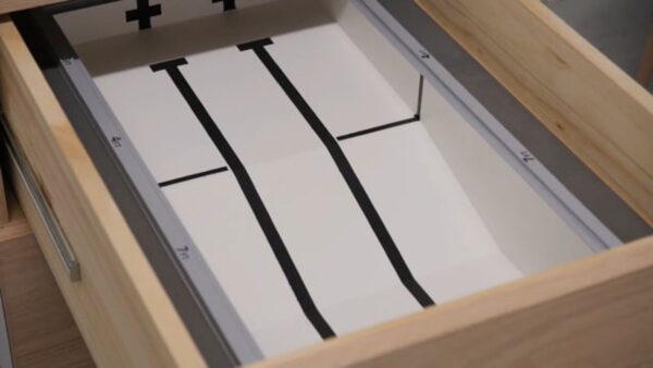 A three-laned swimming pool in a wooden drawer