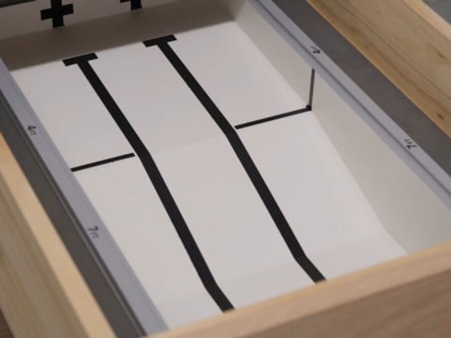 A three-laned swimming pool in a wooden drawer