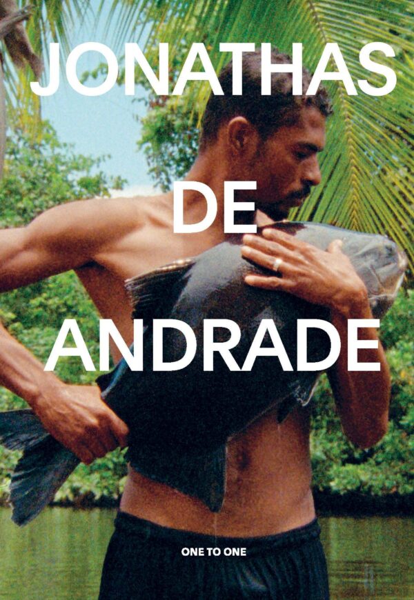 The image of a man holding a fish filled the cover of a book titled Jonathas de Andrade, One to One
