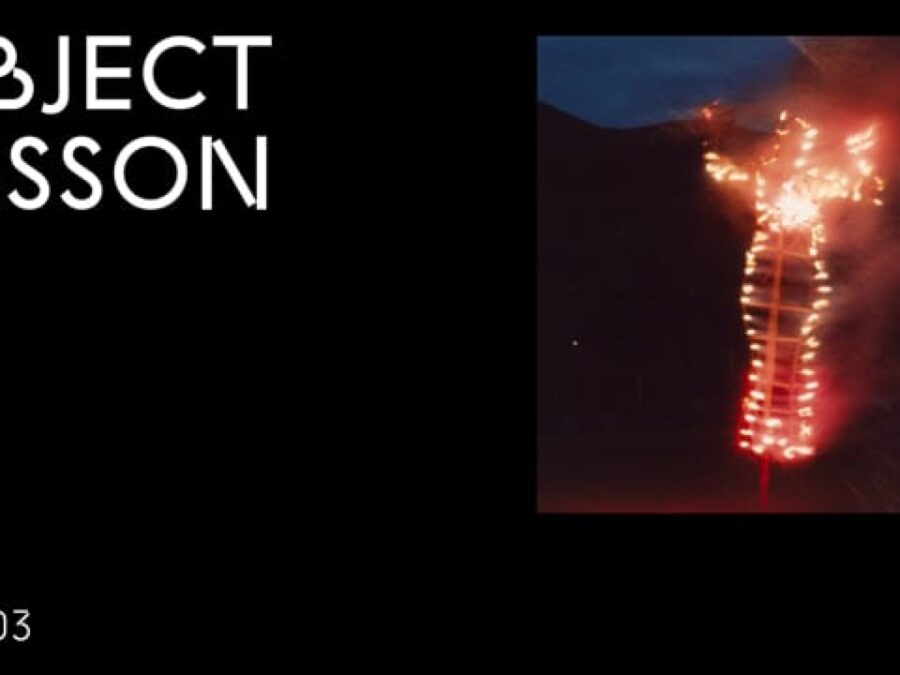 A black rectangle with the words Object Lesson in the upper left hand corner and OL 003 in the bottom left hand corner accompanied by an image of a burning human effigy on the right hand side