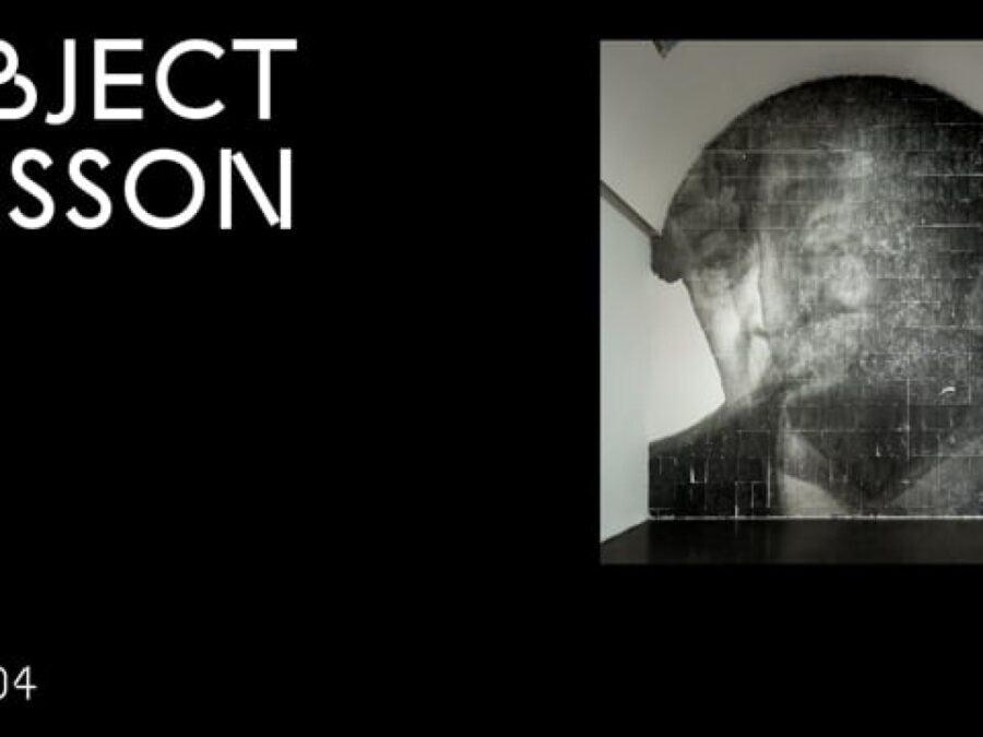 A black rectangle with the words Object Lesson in the upper left hand corner and OL 004 in the bottom left hand corner accompanied by an image of a smoky portrait of a person encompassing a full arched wall in the upper right hand corner