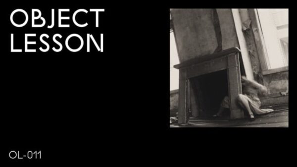 A black rectangle with the words Object Lesson in the upper left hand corner and OL 011 in the bottom left hand corner accompanied by a black and white image of a person next to a fireplace in the upper right hand corner