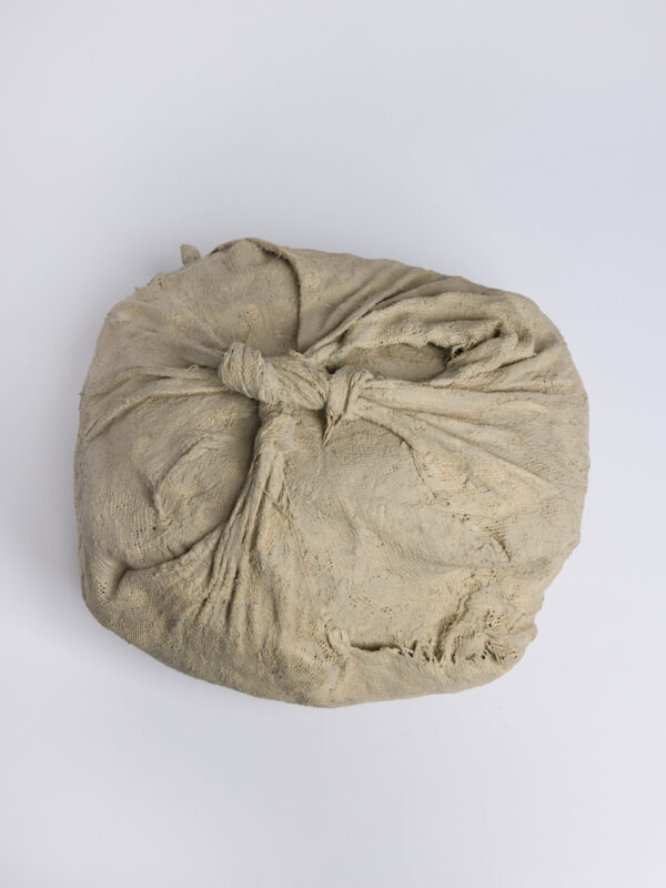 Brown paper twisted up into a ball