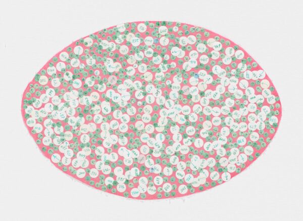A pink oval covered in blue, green, and white dots