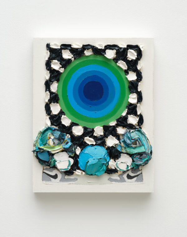 A circle of blue and green rings appears over a black and white grid with round teal objects below