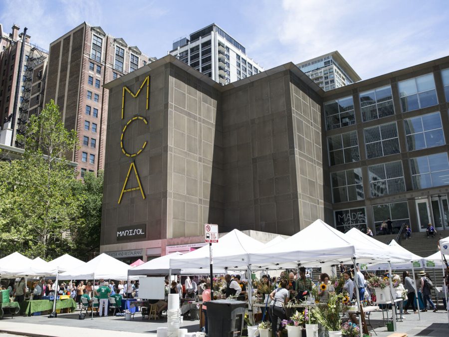 The MCA plaza filled with white sun tents on a sunny day