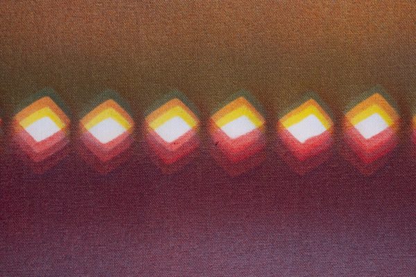 Six layered diamonds in a variety of warm colors in a straight, horizontal formation against a warm, blended ombre background.