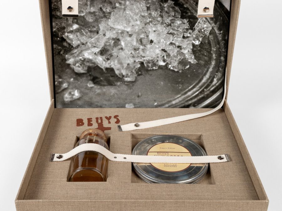 An open suitcase filled with a variety of objects.