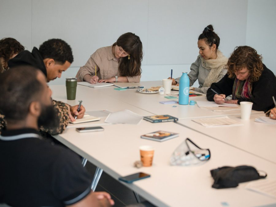 A group of teachers takes part in a poetry-centered curriculum workshop.