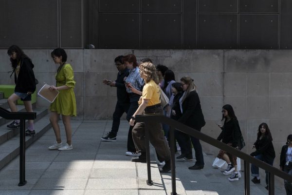 A group of people walking up stairs