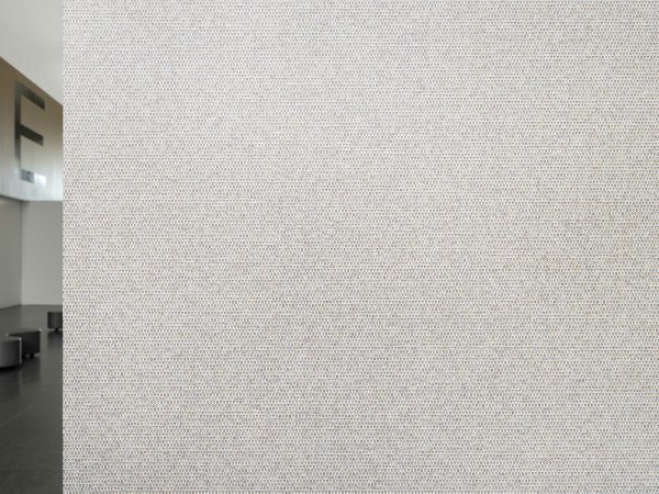 The corner of a wall covered in dots.