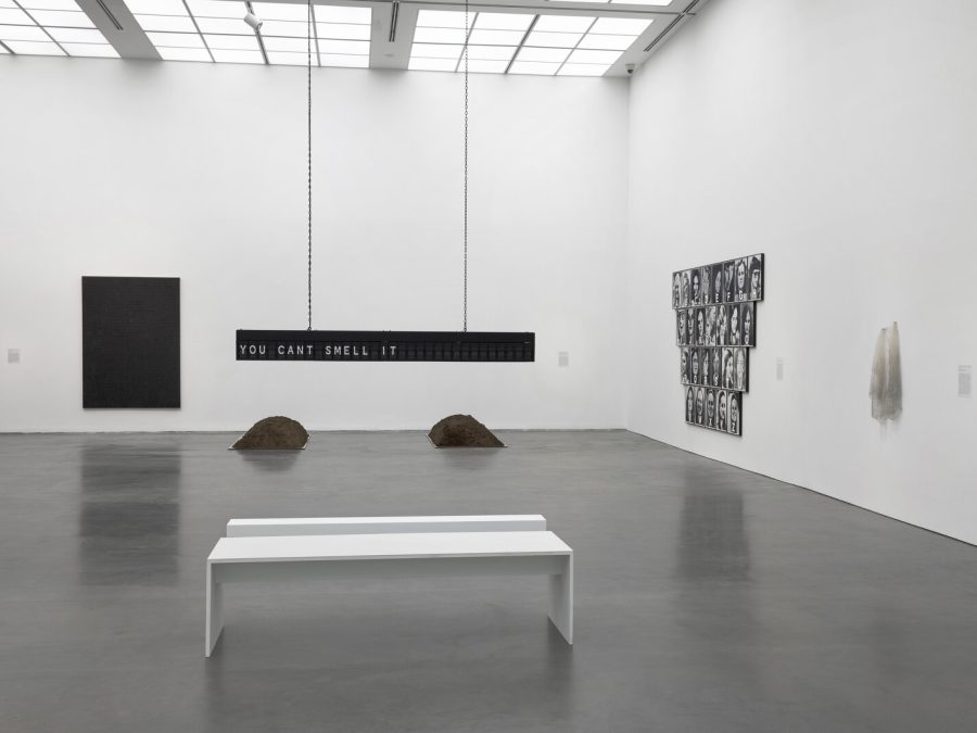 White-walled gallery space with several works on view.