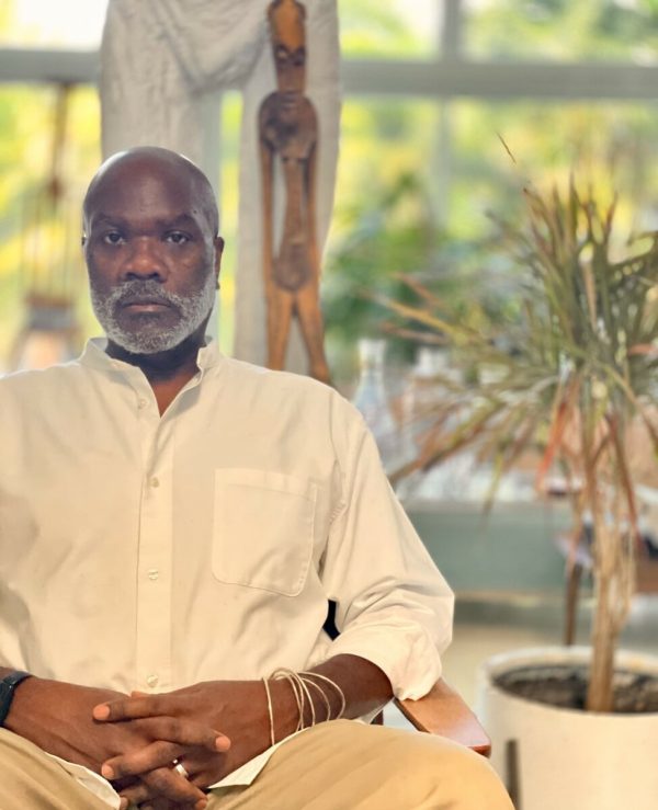 Photo of Jafari S. Allen seated in a chair.
