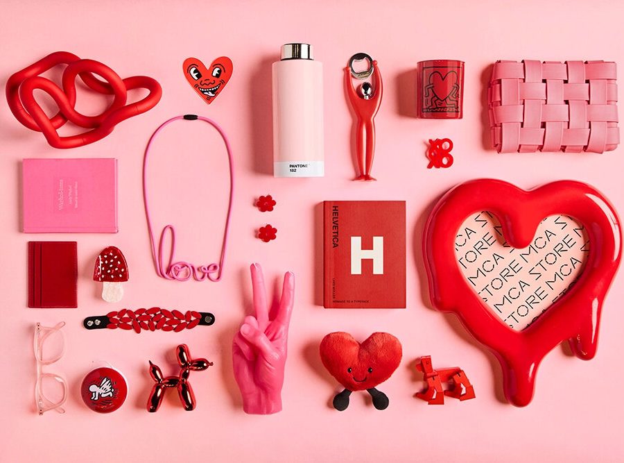 A variety of pink and red objects against a pink background.