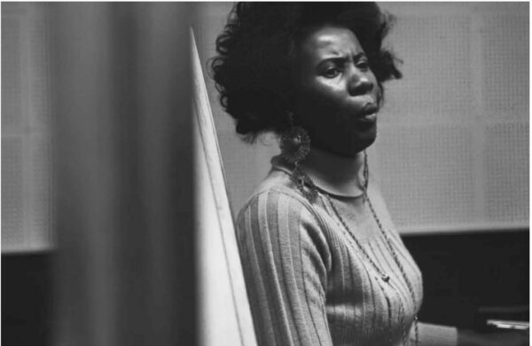 Archival black and white image of a woman with darker skin