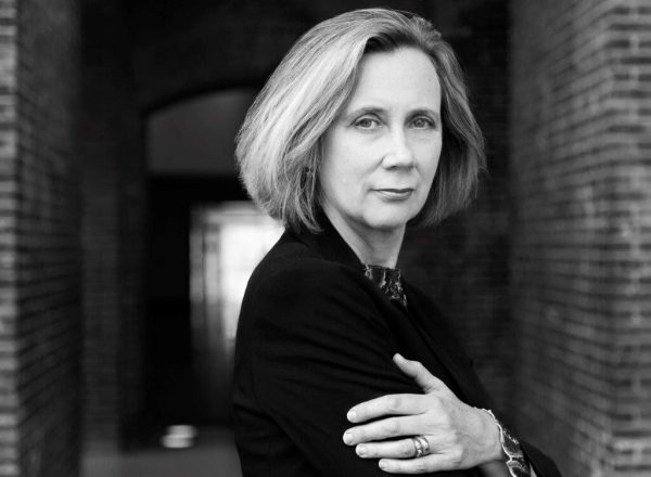 Black and white image of a woman looking at the camera.