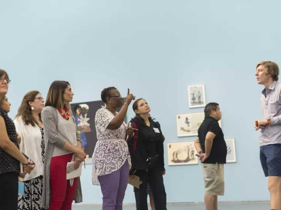 A tour group gathered in gallery space