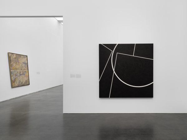 Gallery with one large painting hung on the wall. A view into a second room reveals another painting.
