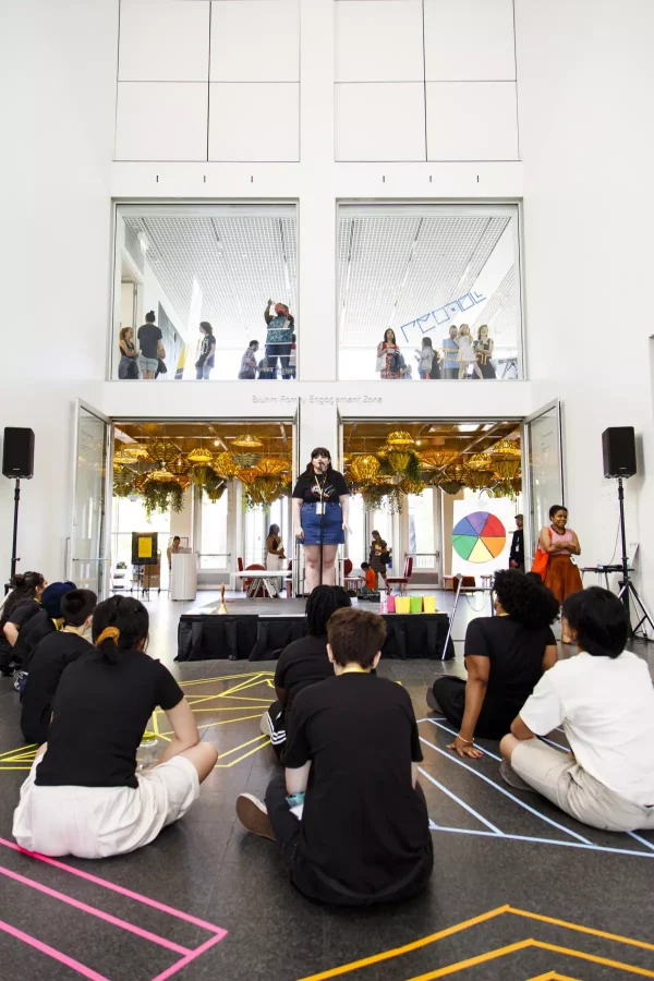 view of performer on stage in front of audience