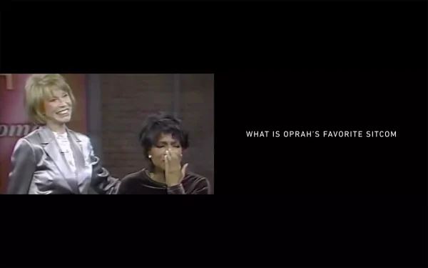 Archival still from the Oprah Winfrey Show with the caption 'what is Oprah's favorite sitcom'