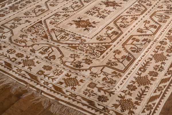 Wooden floor carved to look like a Persian rug.