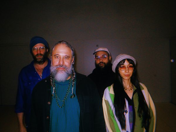 A band portrait featuring four members.