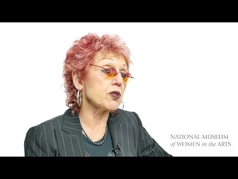 Judy Chicago against a white background with the words National Museum of Women in the Arts in the lower-right corner