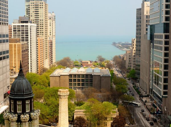 An aerial photograph captures views of the MCA, Lake Michigan, and surrounding buildings.