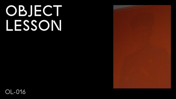 A black rectangle with the words Object Lesson in the upper left hand corner and OL 016 in the bottom left hand corner accompanied by a red vertical artwork in the upper right hand corner