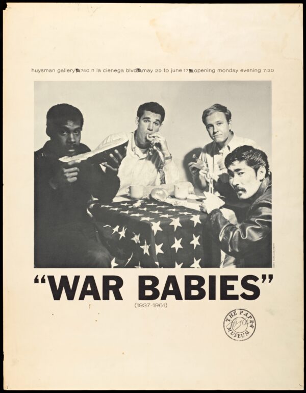 Big bold black text reading War Babies appears beneath a photograph of four people of various ethnicities eating food on a table covered with the American Flag. Above the photo is information on the gallery and opening times.