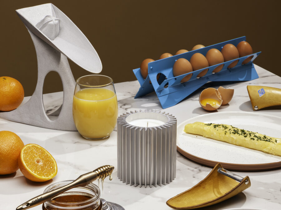 A table set for breakfast with fresh orange juice, eggs, honey, and toast