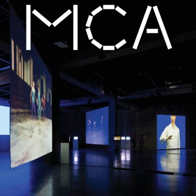 MCA magazine cover featuring an installation in a dark room of several screens placed at different heights and angles with stills of people or dance performances on them