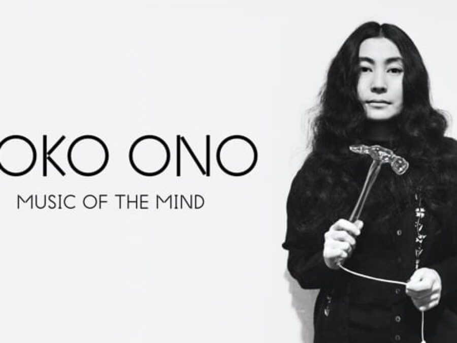 Yoko Ono holds a hammer next to black text reading Yoko Ono Music of the Mind