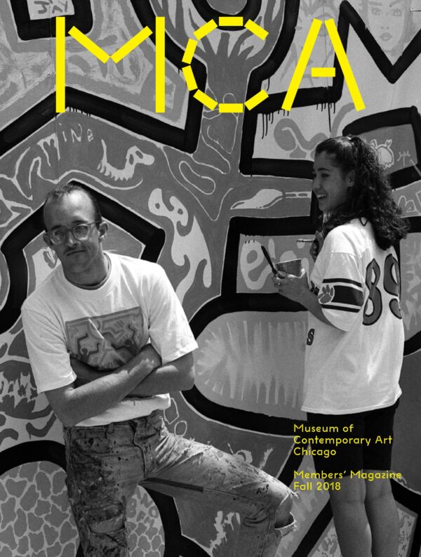 Cover of the MCA fall 2018 members' magazine featuring an archival image of Keith Haring with a teenager in front of a giant mural of his artwork