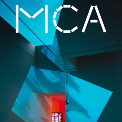 Cover of the MCA Members' Magazine for Fall 2016 featuring a dark gallery space with blue squares projected onto it near a door to a room lit burnt orange