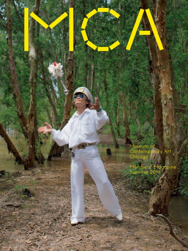 Cover of the MCA Members' Magazine for Summer 2016 featuring a person in a white captain's outfit in the middle of a forest tossing a feathered baton into the air