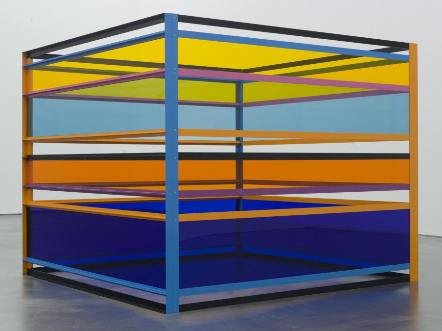 A box constructed out of see through bands of colorful material
