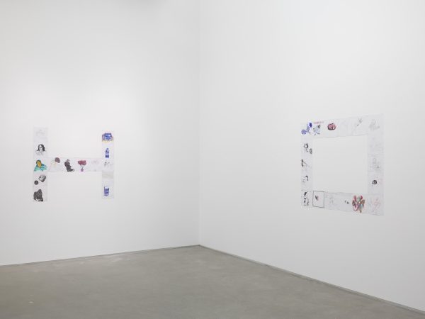 The letters H and O on two adjacent white walls made up of small images