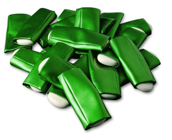 Several green vinyl objects with white inserts that look like cut up green beans.