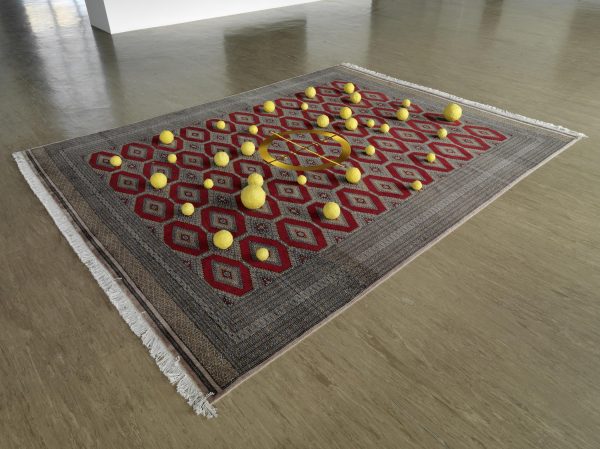 Yellow balls of various sizes on a Persian style rug