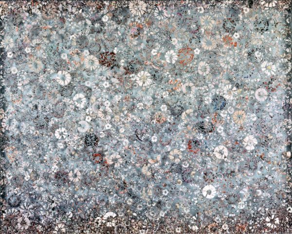 Abstract collage of circular objects in various blues and greys, with a few browns